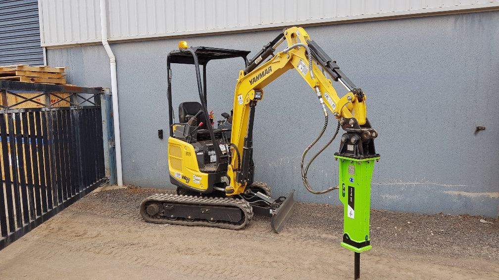 Yanmar VIO17 mini excavator equipped with an Impact Attachments 100 Series hydraulic breaker, ideal for precise demolition tasks in confined spaces.