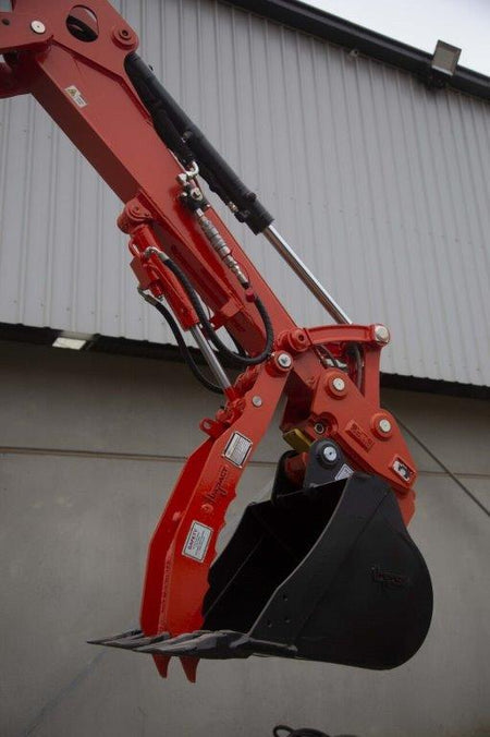Close-up of an Impact Attachments hydraulic thumb in bright red, mounted on an excavator arm. The hydraulic thumb features a serrated edge designed for gripping and handling materials efficiently. The attachment is equipped with high-quality hydraulic fittings and hoses for optimal performance. Ideal for excavation and material handling tasks, this heavy-duty attachment showcases the durability and precision engineering of Impact Attachments.