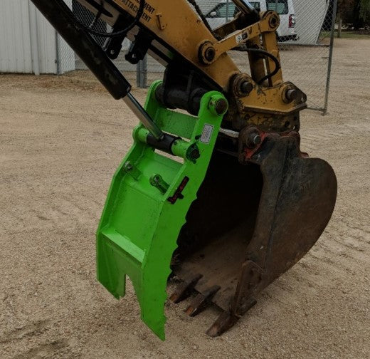 Excavator equipped with an Impact hydraulic thumb attachment, ideal for precise material handling, demolition, and excavation tasks.