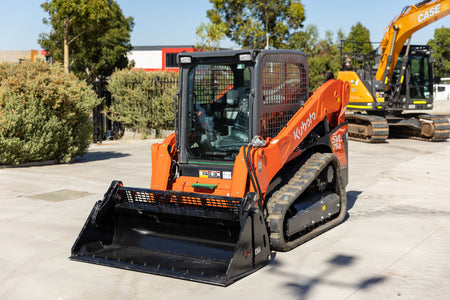 Kubota SVL75-2 track loader equipped with an Impact 4 in 1 bucket attachment, ideal for versatile excavation, material handling, and construction tasks.