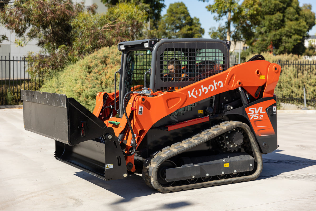 Kubota SVL75-2 track loader equipped with an Impact 4 in 1 bucket attachment, ideal for versatile excavation, material handling, and construction tasks.