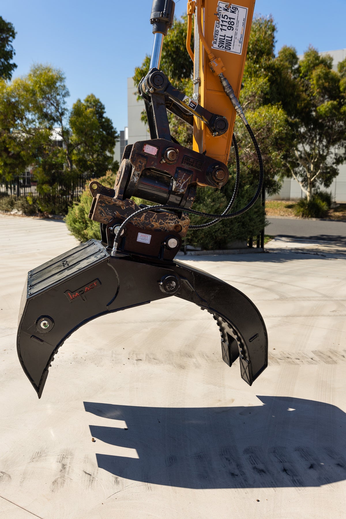 CASE excavator equipped with an Impact five finger grab, used for material handling and debris removal in construction and demolition projects. The heavy-duty grapple attachment enhances the excavator's versatility, making it ideal for demanding earthmoving tasks
