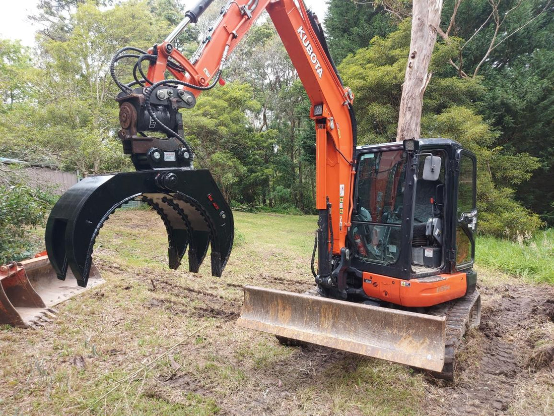 This image features an Impact brand five-finger grab attachment mounted on an excavator, designed for heavy-duty material handling tasks in construction and demolition projects. The close-up view highlights the grab's durable construction, making it ideal for efficiently sorting, lifting, and moving various materials, including debris, timber, and scrap metal. This attachment enhances the excavator's versatility and productivity in challenging work environments.