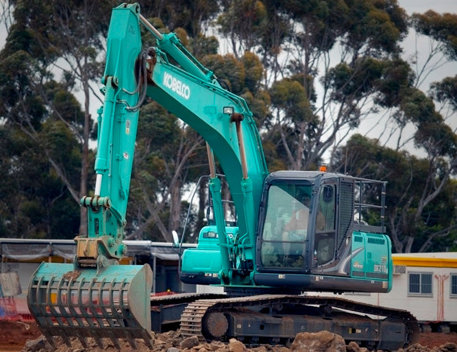 Kobelco excavator equipped with an Impact Attachments sieve bucket, sorting and handling rocks at a construction site
