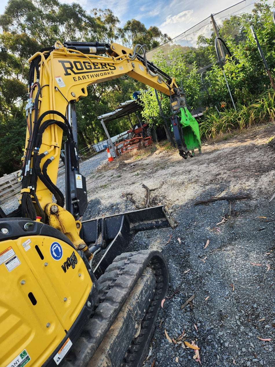 Impact brand heavy-duty grapple bucket attachment mounted on a Volvo excavator, designed for efficient material handling, demolition, and clearing tasks. The robust construction and powerful gripping capability of this grapple bucket make it ideal for various construction, forestry, and recycling applications, enhancing operational productivity and precision