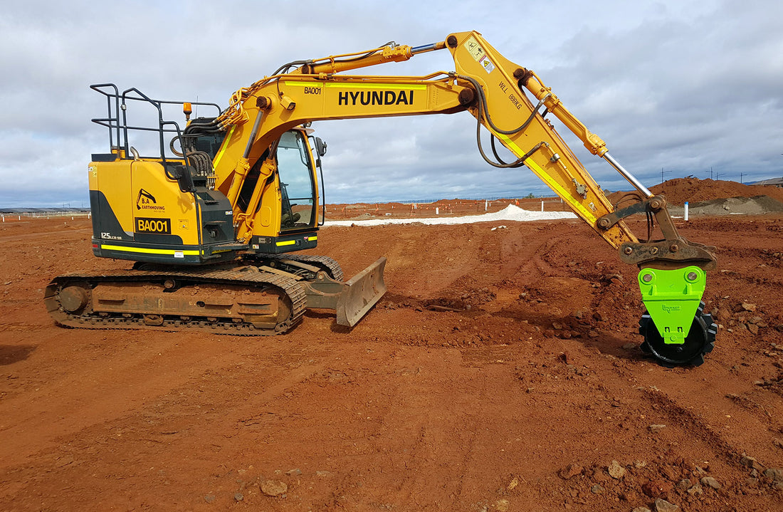 Excavator using compactor wheel